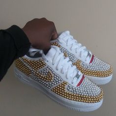 Custom Bling Out Gold & Silver Pearl Nike Air Force 1s. Each Shoe Is Hand Designed With Crystals Being Placed One By One, Making This A Time Consuming Process But The End Result Is Truly A Stunning Work Of Art & Worth Every Penny. Please Be Aware That Processing Time Is 2 Weeks & This May Vary Depending On The Shoe & Design Being Done. Sneakers May Be Shipped Without The Box If Doesn't Fit Once Wrapped. Shoes Will Be Packaged Securely. Please No Offers. Made To Order. Also Available Is Black. Nike Gold High-top Custom Sneakers, Nike Custom Gold Round Toe Sneakers, Gold Nike Custom Low-top Sneakers, Nike Custom Gold Sneakers, Nike Custom Gold Low-top Sneakers, Gold Low-top Nike Custom Sneakers, Nike Custom Low-top Gold Sneakers, White Low-top Custom Sneakers With Bling, White Custom Sneakers With Bling, Round Toe