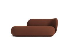 a brown couch sitting on top of a white floor