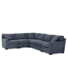 a large sectional couch with two reclinings and one end facing the corner, in grey