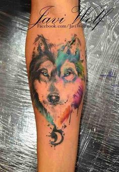 a colorful wolf tattoo on the leg