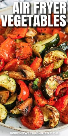 grilled vegetables on a plate with text overlay that says air fryer vegetables