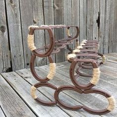 four brown and white chairs sitting on top of a wooden deck