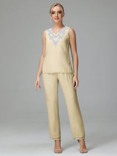 Look stylish and sophisticated in this 3-piece Chiffon Paillette Mother of Bride Dress Pant Suits. The luxurious chiffon fabric and paillettes provide an elegant statement while still keeping you comfortable. Perfect for any special occasion.          Details:     Fabric: Chiffon  Neckline: V Neck  Sleeve Length: Long Sleeves  Dress Length: Floor Length   Available in full size range (US0-US30) and in   custom size Luxury Elegant Georgette Pant Set, Beige V-neck Elegant Sets, Luxury Floor-length Georgette Pant Set, Elegant Beige V-neck Sets, Elegant Semi-stitched Chiffon Blouse Piece, Champagne Floor-length Mother Of The Bride Dress, Champagne Embellished Floor-length Mother Of The Bride Dress, Dress Pant Suit, Chiffon Material