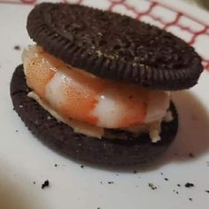 an oreo sandwich is sitting on a plate