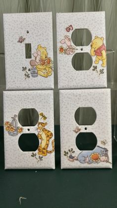 four white boxes with winnie the pooh pictures on them