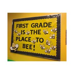 a bulletin board that says first grade is the place to bee with bees on it