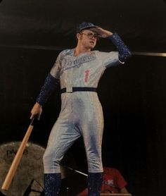 a statue of a baseball player holding a bat