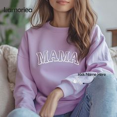 Embrace the warmth of motherhood with our Personalized Mama Sweatshirt featuring the names of your beloved kids elegantly displayed on the sleeves. This thoughtful sweatshirt makes for the perfect Mother's Day or birthday gift, ideal for celebrating the special moments in a mom's journey. It's a heartfelt and stylish way to show appreciation, making it an excellent choice for new moms or as a unique addition to any mom's wardrobe. Mother's Day Birthday Crew Neck Sweatshirt, Casual Sweatshirt For Birthday And Mother's Day, Mother's Day Family Matching Crew Neck Sweatshirt, Family Matching Crew Neck Sweatshirt For Mother's Day, Mother's Day Sweatshirt With Name Print And Crew Neck, Mother's Day Gift Sweatshirt, Casual Mother's Day Sweatshirt For Family, Family Letter Print Long Sleeve Sweatshirt, Family Occasion Sweatshirt With Letter Print And Long Sleeves