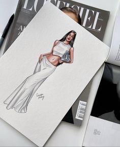 a drawing of a woman in a white dress on top of magazine pages with pen and ink