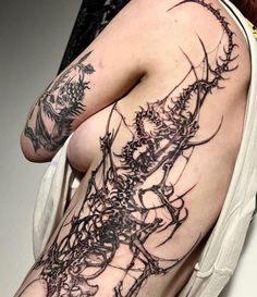 a woman's arm with tattoos on it