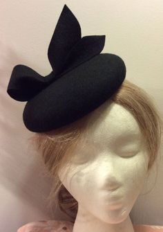 Currently Ready to ship - ship out in 3-5 days. OVERVIEW -------------- This design was inspired by those of Duchess of Cambridge - Kate Middleton's fascinators. This hat would look much better if you wear it on the right side of the head. DETAILED DESCRIPTION --------------------------------- This listing is for a chic handmade 100% Merino wool fascinator hat in BLACK color. It features a cute looped bow - full of elegance and character.  I could make this design in more than 100 colors, just message me or leave me a note during checkout.  Wool fascinators are not just for the royalty or the high society. Everyone looks at their best wearing them and they are appropriate on nearly all occasions. They are not flashy or swanky: instead, they are the embodiment of a timeless elegance back in Handmade Formal Hats, Classic Black Fascinator For Party, Handmade Fitted Hats For Formal Occasions, Handmade Fitted Formal Hats, Classic Black Mini Hats For Party, Classic Black Party Fascinator, Black Wide Brim Hat As A Gift, Black Wide Brim Hat As Gift, Formal Fitted Handmade Hats