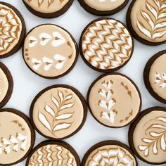 cookies decorated with frosting and leaf designs