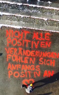 an aerial view of a person writing on the ground