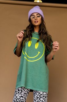 Lala Original Designs are thoughtfully designed in-house. These clothes were made for you. - Huge smile face printed on the front- The World Needs Your Magic printed on the back- Neon yellow graphics- Sage green background color- Thick + soft lived-in feeling cotton- Majorly oversized fit- Boxy short sleevesSIZING GUIDE:Meant to have an oversized fit. S/M is equivalent to unisex XL. L/XL is equivalent to unisex 3XL. Symone is 5'8, typically wears a size 2 and is wearing a S/M. Lex is 5'8, typically wears a size 6 and is wearing a S/M.100% cottonWash in cold inside out, gentle cycle + air dry © Dressed in LALA™ 2024 // Design owned and created by Dressed in LALA™ Smiley Face Top For Loungewear, Relaxed Fit Smiley Face Top For Loungewear, Green Oversized Graphic Tee, Trendy Oversized Green T-shirt, Green Graphic Print Top For Loungewear, Trendy Oversized Smiley Face Top, Oversized Smiley Face Crew Neck Top, Green Graphic Tee For Loungewear, Green Graphic Print T-shirt For Loungewear