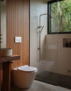 a bathroom with a toilet and shower in it