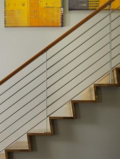 a clock sitting on the side of a stair case