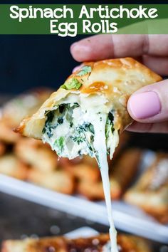 spinach artichoke egg rolls being held up to the camera with text overlay that reads spinach artichoke egg rolls