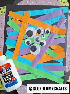 the craft is made with construction paper and glue to make an eyeball maze for halloween