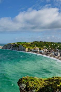 an ocean view with houses on the cliff