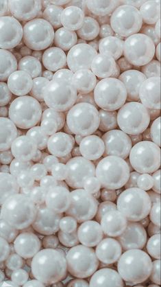 white pearls are piled together in a pile