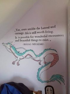 a bedroom with a dragon decal on the wall and a quote above it that says, yet even amidst the harted and carmagege life is still worth living