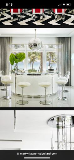 the interior of a modern home with black and white checkered flooring, chandelier, bar stools, and round dining table