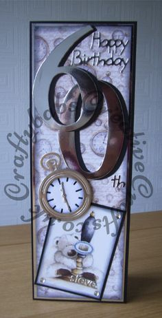 a birthday card with an image of a clock and two rings on it's front