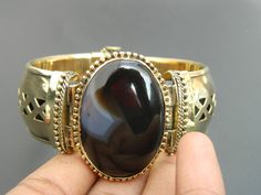 "you will receive One Black Onyx Agate Stone Brass Metal Cuff Bangle Bracelet Handcrafted Vintage Style Traditional Ethnic Bohemian Style Fashion Jewelry Gift Sale Bangle inner diameter:  2.4\" approx. Thank you very much for visiting! Any questions, please feel free to contact us. Discount for bulk provide." Adjustable Agate Bohemian Cuff Bracelet, Bohemian Agate Cuff Bracelet Adjustable, Adjustable Bohemian Agate Cuff Bracelet, Bohemian Agate Cuff Bracelet Gift, Handmade Black Bohemian Bangle, Bohemian Gold Cuff Bracelet With Natural Stones, Bohemian Gold Cuff Bracelet With Gemstone, Gold Bohemian Cuff Bracelet With Natural Stones, Bohemian Cuff Jewelry