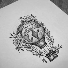 a pencil drawing of a light bulb with flowers on it and the earth in the middle