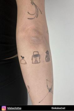 a woman's arm with tattoos on it