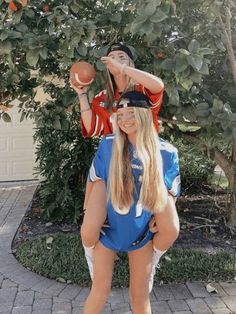 a man and woman dressed up as football players