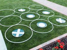 a lawn with circles and crosses painted on it