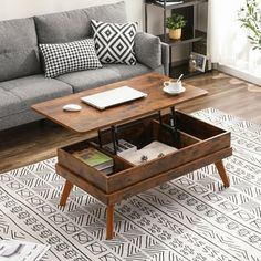 a living room with a couch, coffee table and bookshelf on the floor