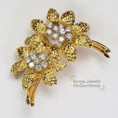 This yellow 18k gold Vintage GUBELIN Diamond Flower Brooch is simply stunning and rare! The two flowers each have 8 to 9 sparkly white diamond rounds in the middle totaling 1.78 carats that bring the brooch to life.Total Weight: 23.68 gramsSize: 2 inches tall, 1.7 inch widePrecious Metal: 18k yellow gold Precious stones:-White Round Diamonds Elegant Diamond Flower Brooch, Elegant Diamond Flower Brooches, Diamond Flower Brooch For Formal Occasions, Formal Diamond Flower Brooch, Yellow Gold Brooches With Single Cut Diamonds For Anniversary, Diamond Yellow Gold Brooch For Anniversary, Anniversary Diamond Brooch In Yellow Gold, Elegant Gold Diamond Brooch, Anniversary Yellow Gold Diamond Brooch