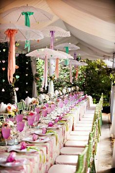 an image of a table set up with umbrellas for a bridal shower party