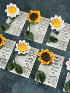 crocheted sunflowers are placed on cards with words written in them to spell out the names of those flowers