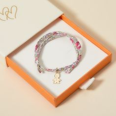 For a little one who loves to match with mommy, our Children’s Personalized Boy Liberty Bracelet is the perfect gift for a birthday, christening or milestone moment. Each bracelet can be personalized to capture their unique personality, with a choice of five colourful Liberty braid prints and their name hand-engraved onto the mini boy charm.18K Champagne Gold Plated, 925 Sterling Silver or 18K Rose Gold PlatedMini Boy: &nbsp;0.47 x 0.31Liberty braid with fully adjustable sliding knot fasteningHand-engraved in our Paris workshopSent with love in a complimentary gift boxAny slight variations in lettering depth, spacing and alignment from the examples shown are part of the aesthetic and originality of the pieceChildren’s Warning: please note, this piece of jewelry is not a toy. We advise Cute Personalized Friendship Bracelets For Mother's Day, Mother's Day Personalized Pink Charm Bracelet, Pink Birthstone Bracelet For Gift, Pink Birthstone Bracelet As Gift, Personalized Multicolor Charm Bracelet For Gift, Cute Charm Bracelet For Mother's Day Gift, Personalized Pink Bracelets As Gift For Mom, Personalized Pink Bracelet As Gift For Mom, Personalized Pink Bracelet As A Gift For Mom