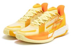 an orange and white tennis shoe on a white background