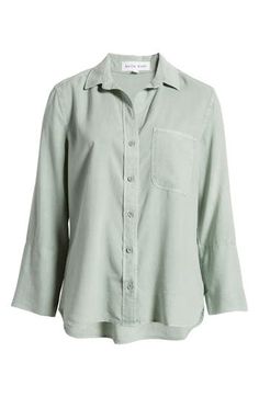 This breezy yet polished button-up is crafted from soft, sustainable Tencel® lyocell with a tuckable shirttail hem. 26" length Front button closure Spread collar Long sleeves Chest pocket 100% Tencel® lyocell Tencel lyocell is a sustainably produced fiber made with closed-loop processing Machine wash, tumble dry Imported Women's Clothing Bella Dahl, Chest Pocket, Oasis, Button Up Shirts, Women's Clothing, Button Up, Nordstrom, Long Sleeves, Collar