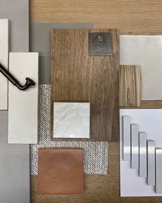 various materials are arranged on top of each other, including tile and wood pieces in different colors