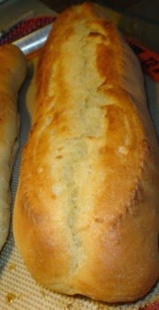 two loaves of bread sitting on top of a table