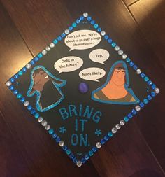 a decorated graduation cap that says bring it on