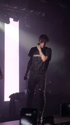 a man standing on top of a stage