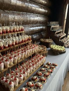 many desserts are displayed on the table