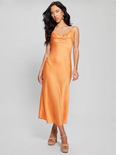 a woman is wearing an orange dress