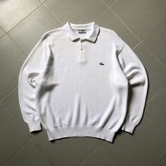 LACOSTE Small Logo Knit Polo Sweater TAG : Lacoste SIZE : X-Large MEASUREMENT , - Width (Armpit to armpit) : 24" - Length (Shoulder the end of garment) : 27" - Shoulder : 21" - Sleeve Length : 23.5" CONDITION : Perfect white colour. No holes and stains. ** PLEASE LEAVE ME YOUR PHONE NUMBER ON THE NOTE AFTER MADE A PURCHASE, ITS FOR COURIER NEEDED ** SHIPPING, all item will be shipped with tracking number. Item received within 14-21 working days. Classic Long Sleeve Knitted Polo Sweater, White Knitted Long Sleeve Polo Sweater, Vintage White Knitted Tops, White Vintage Knitted Top, Logo Lacoste, Knit Polo Sweater, Logo Knit, Knit Polo, Polo Sweater