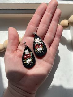 Handmade polymer clay earrings Clay floral dangle earrings on black teardrop base. Boho bouquet floral earrings in black. These clay floral earrings are created from high quality clay and are nickel free. These earrings are super lightweight and comfortable! They also make the perfect boho statement earrings! ** FIND SIMILAR EARRING STYLES HERE: https://www.etsy.com/shop/AmberRaeStudio * Nickel Free * Super Lightweight  * Each pair of earrings is handmade and uniquely designed! No 2 are alike! C Hand Painted Black Polymer Clay Jewelry, Black Polymer Clay Earrings With Ear Wire, Black Hand Painted Drop Earrings, Handmade Black Polymer Clay Earrings, Handmade Black Drop Flower Earrings, Black Polymer Clay Jewelry With Ear Wire, Black Polymer Clay Jewelry With Matching Earrings, Handmade Black Drop Earrings, Black Resin Drop Earrings