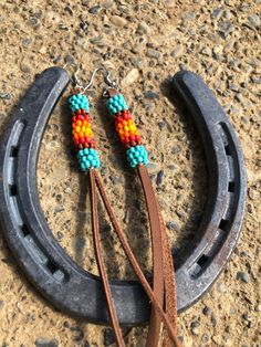 Genuine leather fringe Beaded earrings Southwestern Tassel Earrings For Festivals, Adjustable Brown Earrings With Beaded Fringe, Southwestern Fringe Earrings For Festivals, Southwestern Beaded Fringe Earrings, Southwestern Tassel Earrings, Southwestern Fringe Dangle Earrings, Southwestern Brown Fringe Jewelry, Native American Inspired Earrings, Leather Fringe Earrings