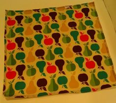 an apple and pear pattern on a yellow background