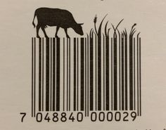 a bar code with an image of a cow grazing in the grass on it's side